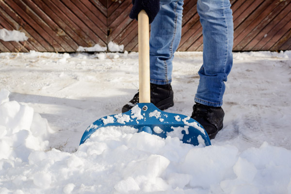 clearing a driveway with a shovel