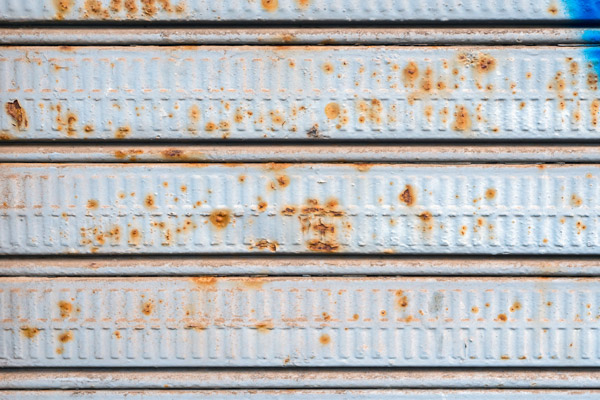 old rusted out garage door
