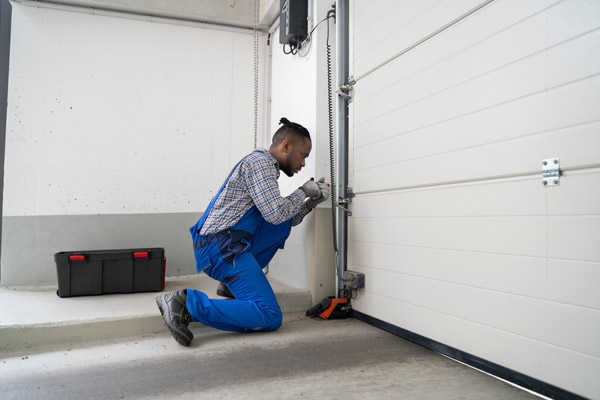 fixing a damaged garage door sensor